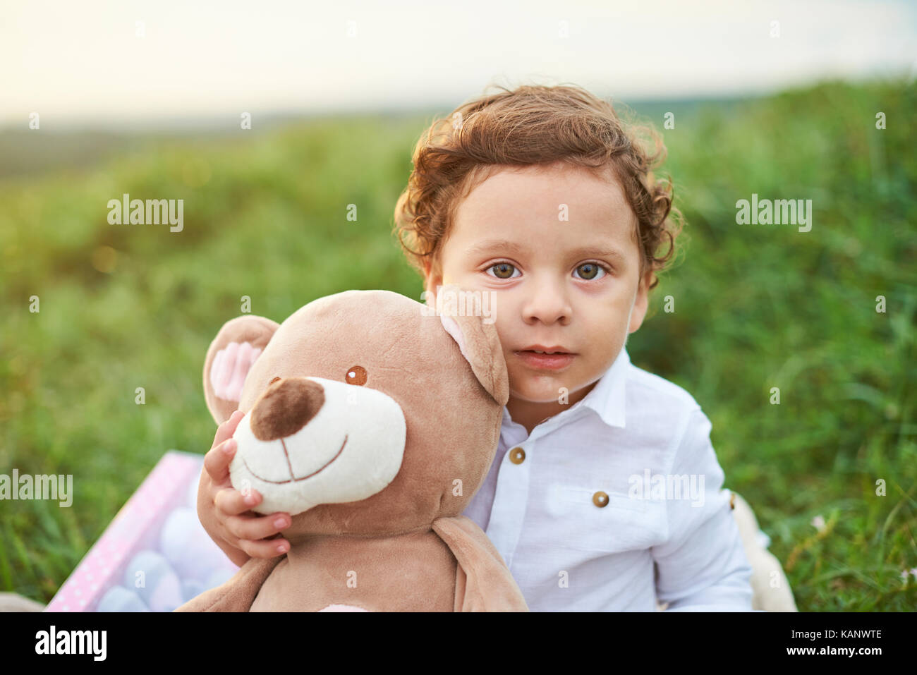 Portrait of hispanic boy kid holding teddy bear Stock Photo - Alamy