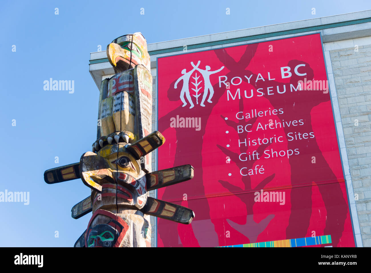 Victoria, BC, Canada - 11 September 2017: Facade of the Royal BC Museum with a totem pole in the foreground Stock Photo