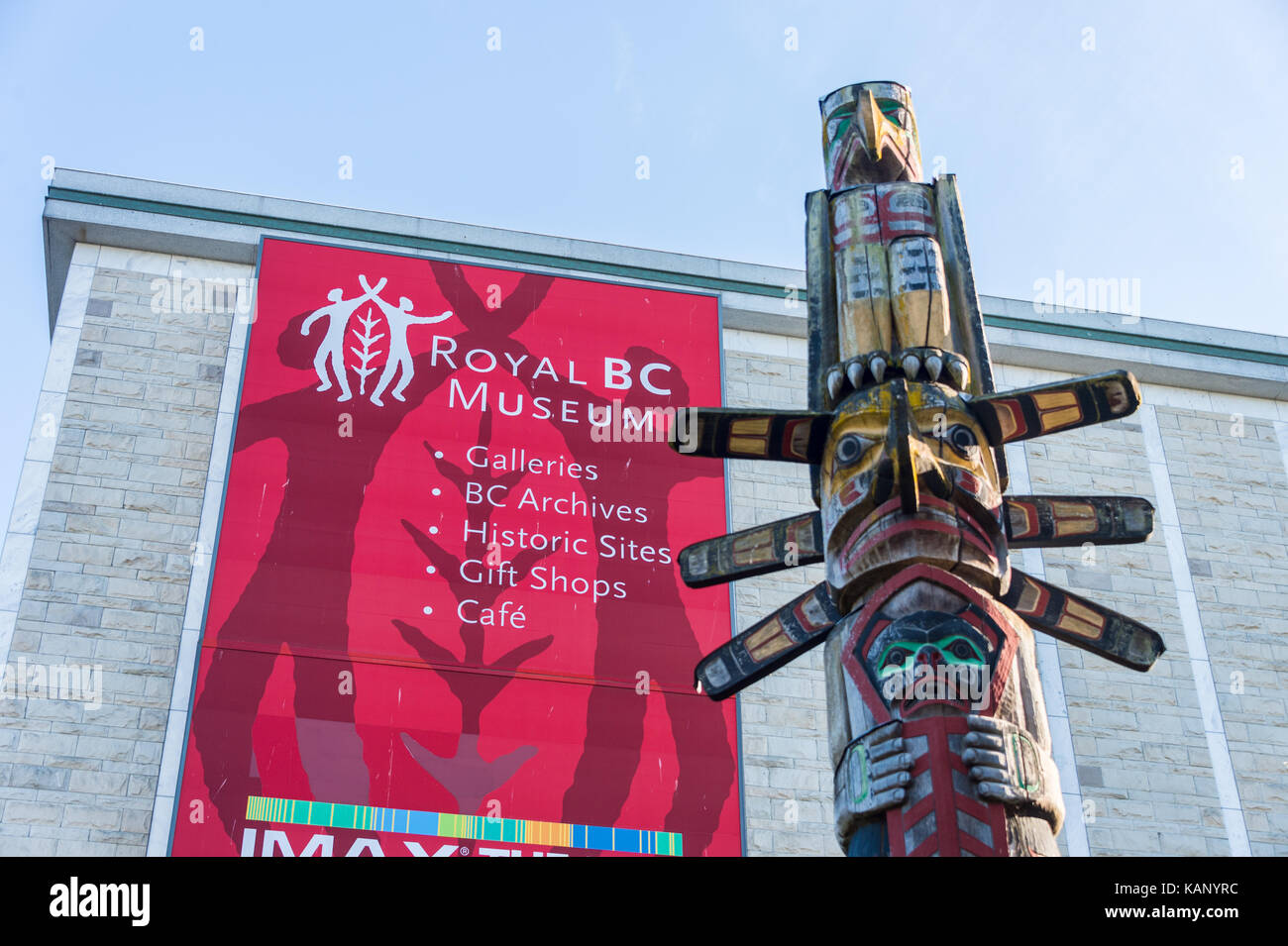 Victoria, BC, Canada - 11 September 2017: Facade of the Royal BC Museum with a totem pole in the foreground Stock Photo