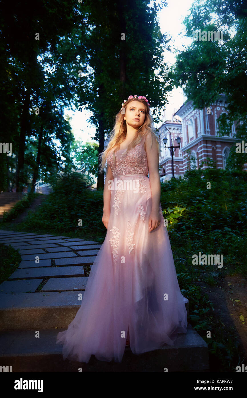 Portrait Of A Beautiful Bride Blond Girl In Pink Lace Dress Hair
