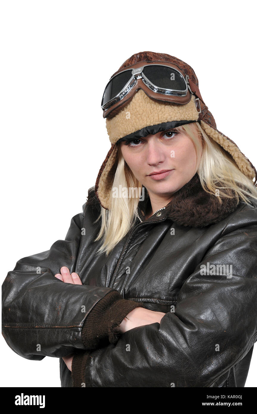 Woman pilot wearing vintage pilot helmet flight jacket and goggles Stock Photo