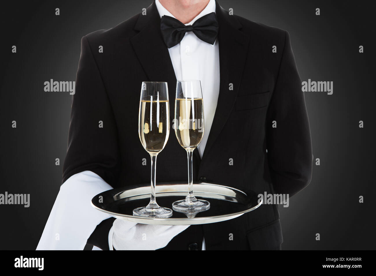 Waiter carrying tray hi-res stock photography and images - Alamy
