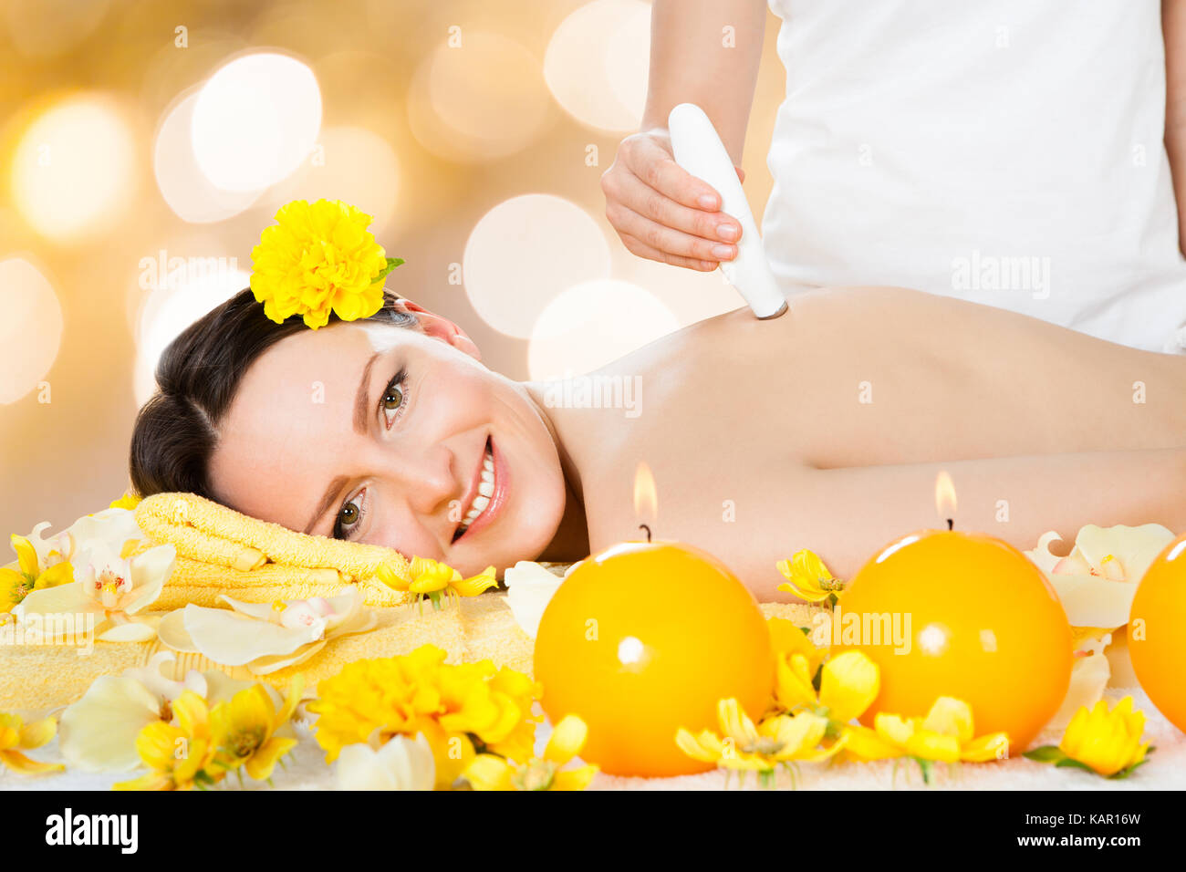 Portrait of beautiful young woman receiving microdermabrasion therapy at beauty spa Stock Photo