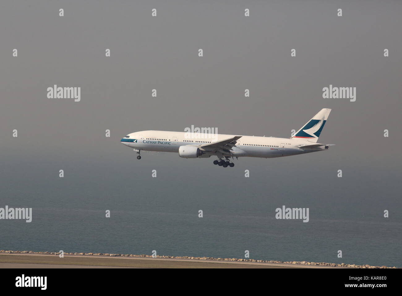 the plane is landing in Hong Kong international airport Stock Photo