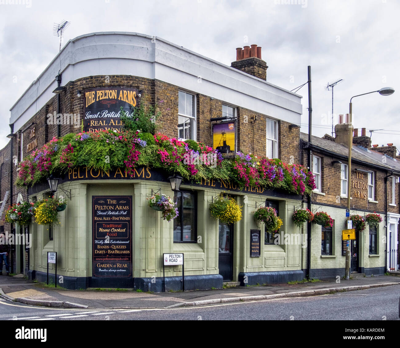 Greenwich, London. The Pelton Arms (previously the Nag's Head), Typical English corner pub with sign and flower baskets.Traditional bar Stock Photo