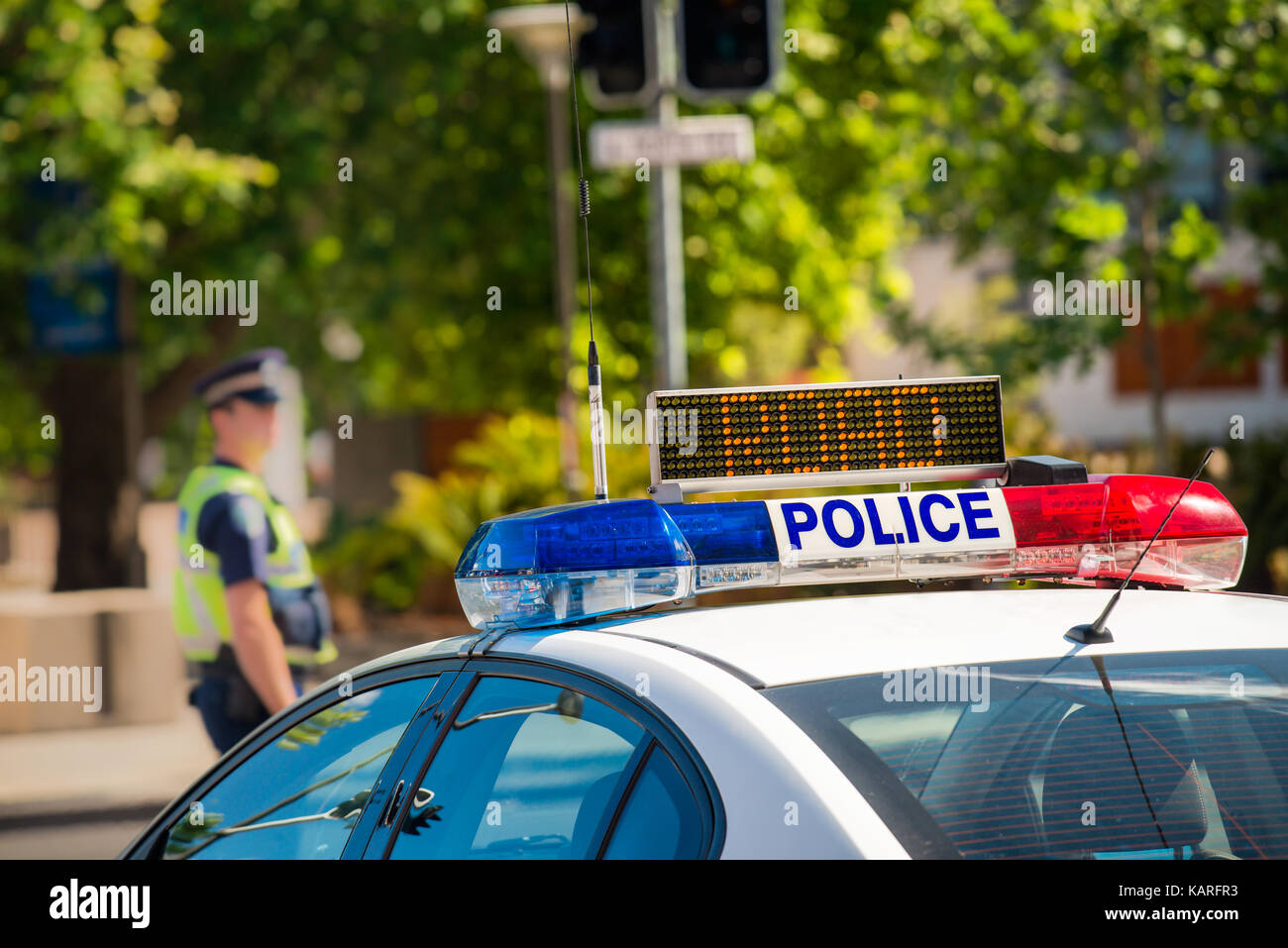 South Australian police car on street in Adelaide with policeman on the background Stock Photo