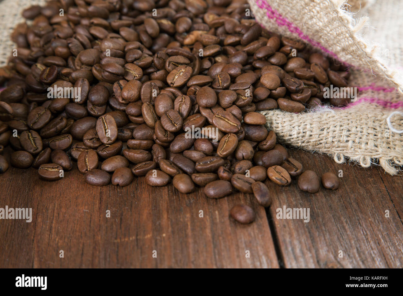 COFFEE GRAIN IN A BAG ON A RURAL TABLE Stock Photo