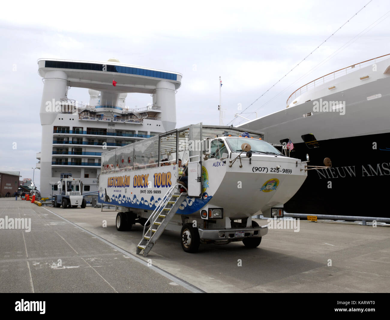 An amphibious Duck Tour 'bus meets cruise ships at Ketchikan, Alaska, USA. Stock Photo