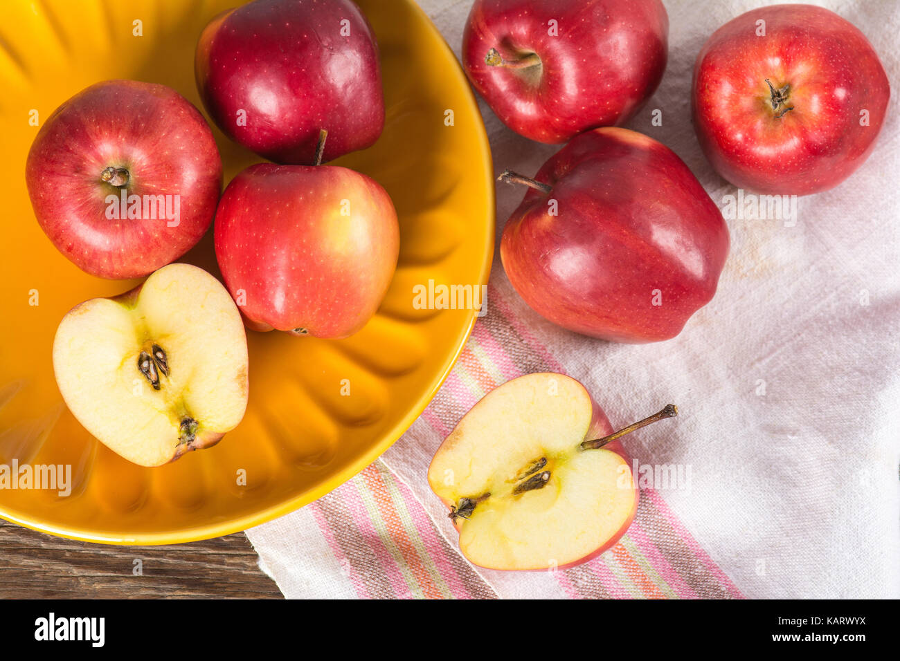 Ripe red apples on plate Stock Photo