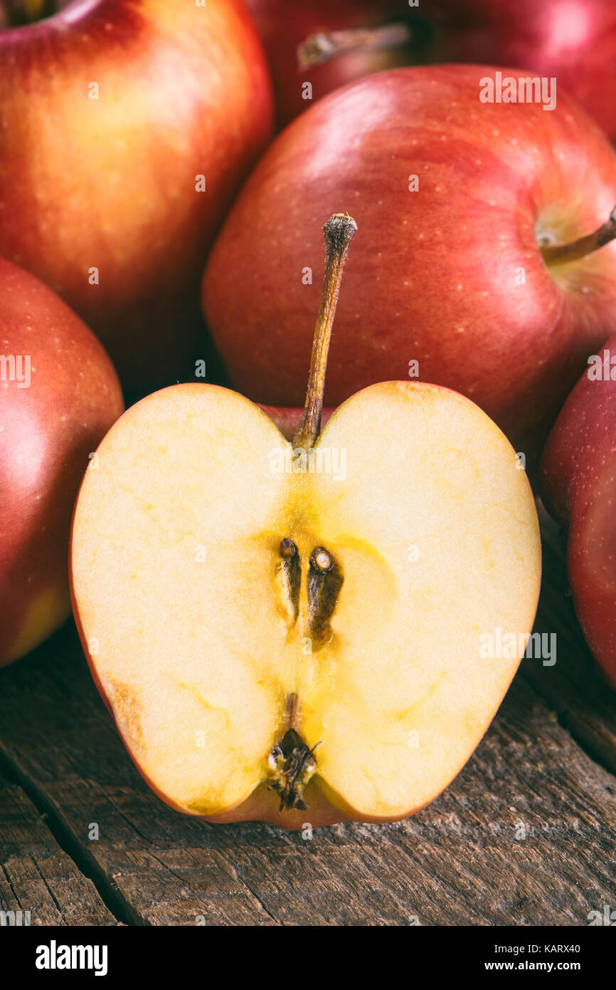 Ripe red apples on wooden surface Stock Photo