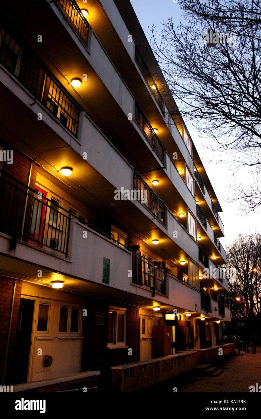 Estate housing lights lit up in the evening Stock Photo