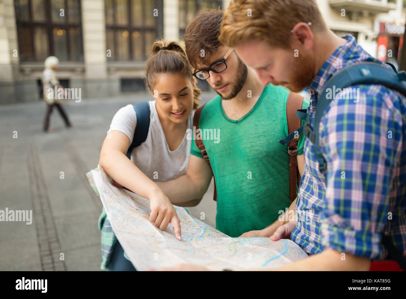 Young happy tourists sightseeing in city Stock Photo