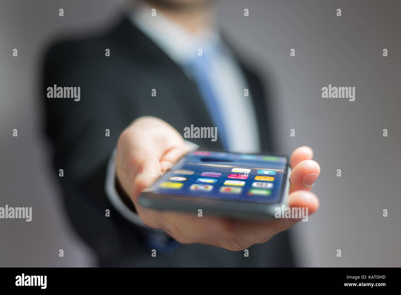 View of a Hand holding black smartphone with operating system screen