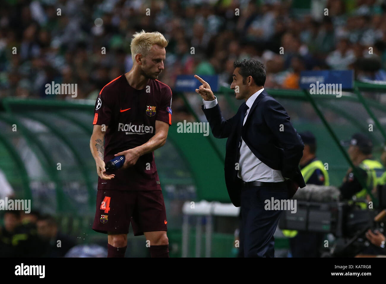 Lisbon, Portugal. 27th Sep, 2017. Barcelona«s midfielder Ivan Rakitic from Croatia (L) and Barcelona«s head coach Ernesto Valverde from Spain (R) during the match between Sporting CP v FC Barcelona UEFA Champions League playoff match at Estadio Jose Alvalade on September 27, 2017 in Lisbon, Portugal. Credit: Bruno Barros/Alamy Live News Stock Photo
