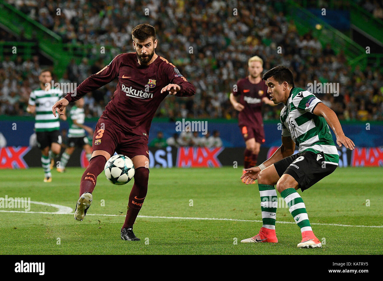 Lisbon, Portugal. 27th Sep, 2017. Gerard Pique from FC Barcelona and Marcos Acuna from Sporting CP in action during UEFA CHAMPIONS LEAGUE football match from group D between Sporting CP and FC Barcelona in Alvalade Stadium on September 27, 2017 in Lisbon, Portugal. Credit: Bruno de Carvalho/Alamy Live News Stock Photo