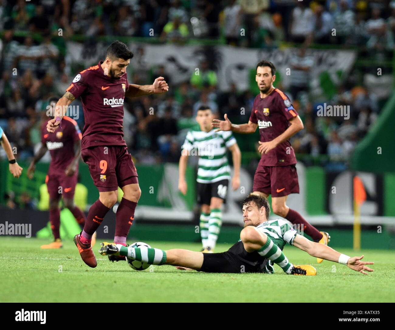 Lisbon, Portugal. 27th Sep, 2017. Barcelona's Luis Suarez (L) vies with  Sporting's Sebastian Coates during the UEFA Champions League group D match  between Sporting CP and FC Barcelona in Lisbon, Portugal, on