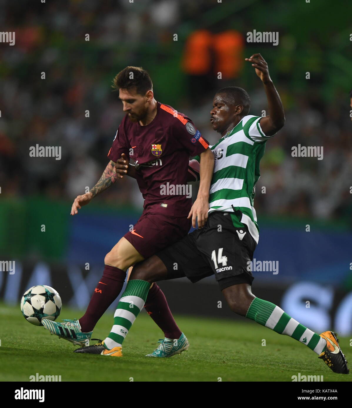 Lisbon, Portugal. 27th Sep, 2017. Barcelona's Lionel Messi (L) vies with Sporting's William Carvalho during the UEFA Champions League group D match between Sporting CP and FC Barcelona in Lisbon, Portugal, on Sept. 27, 2017. Barcelona won 1-0. Credit: Zhang Liyun/Xinhua/Alamy Live News Stock Photo