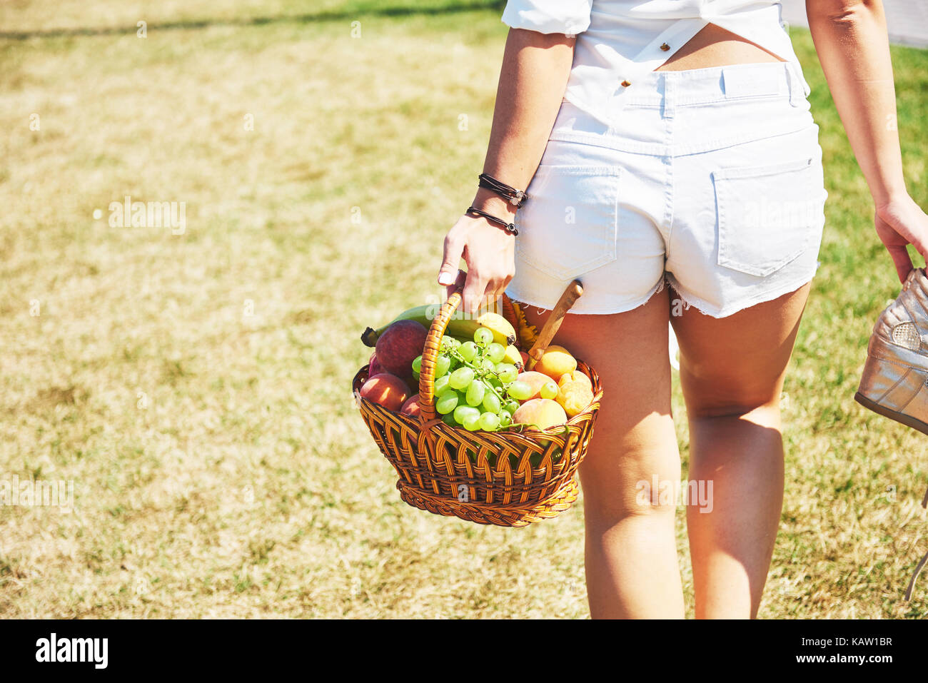 Young girl with basket going to have a picnic Stock Photo