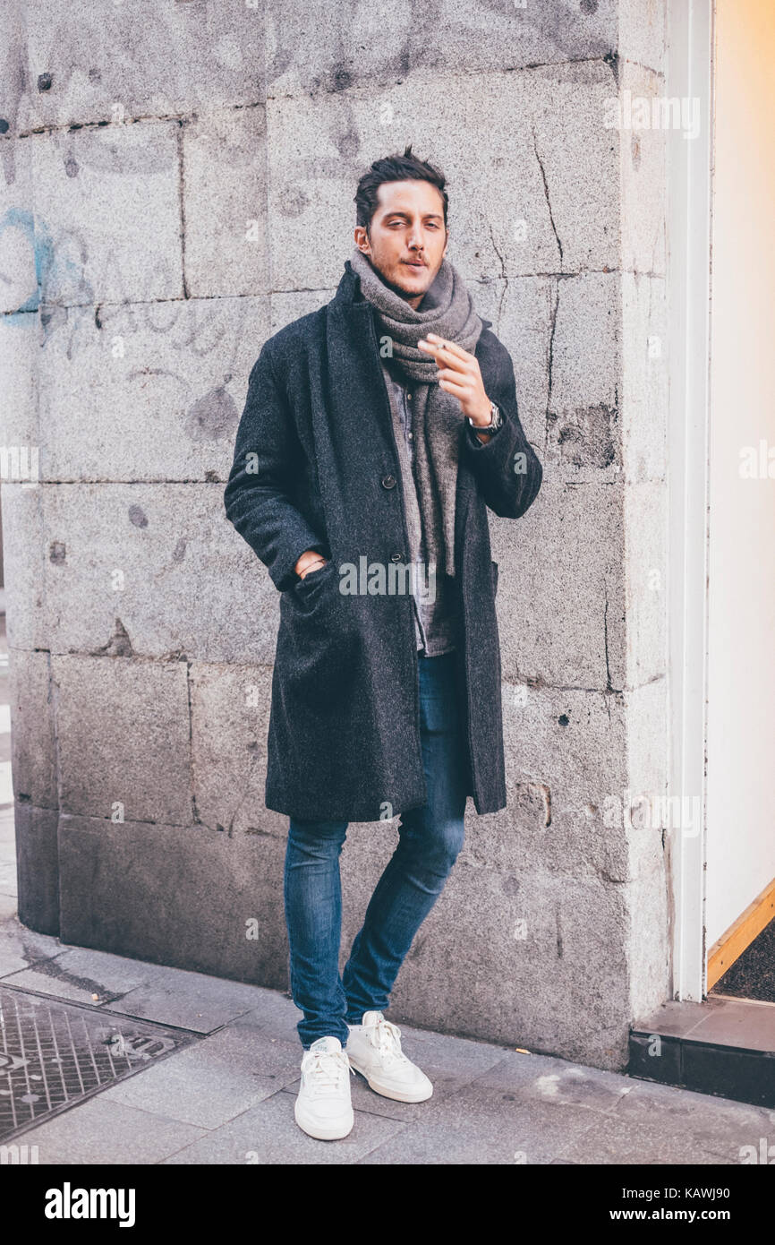 Young man smoking // Street style in Madrid Stock Photo - Alamy