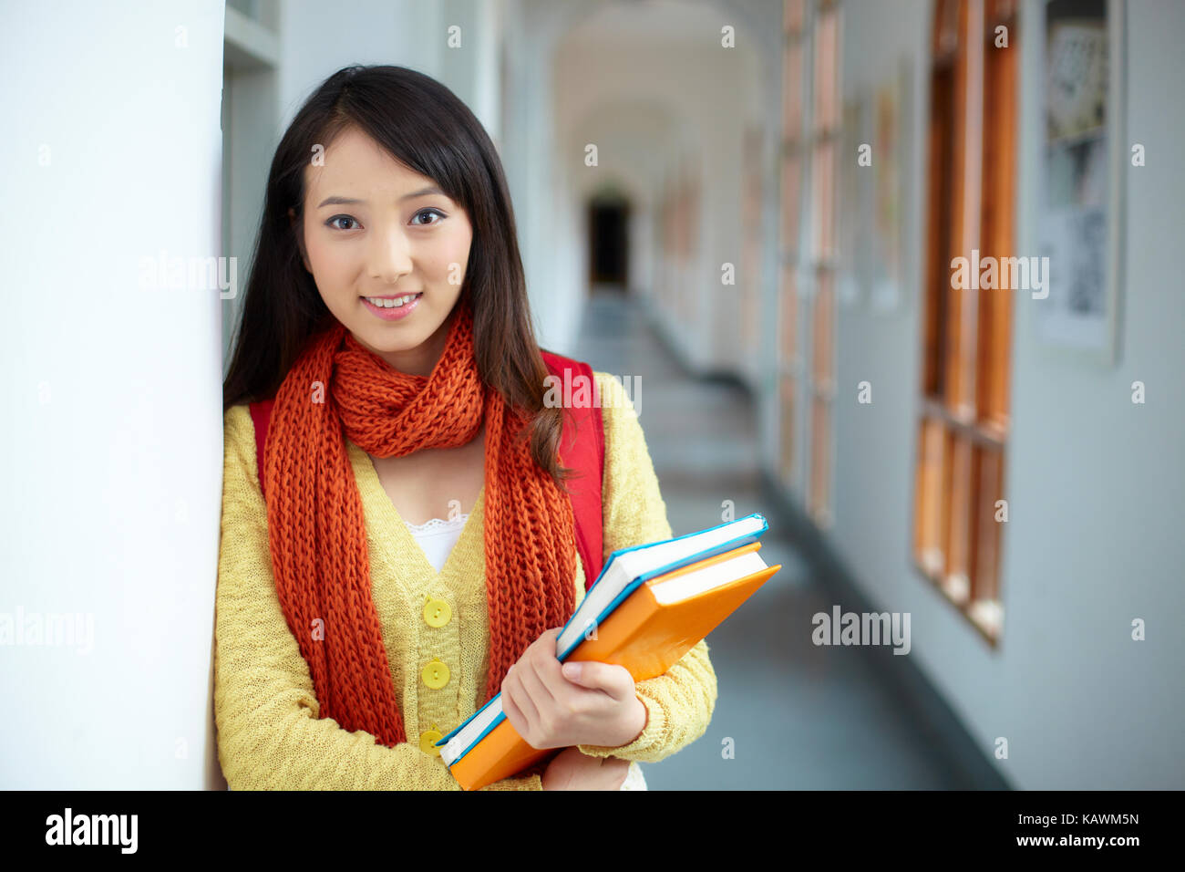 one pretty Chinese asian college student smile at camera in campus Stock Photo