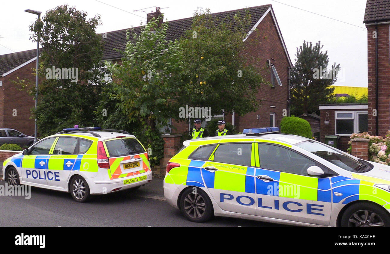 Police at the scene in Greymist Avenue, Woolston, Warrington, Cheshire, following a police counter-terrorism raid where a 31-year-old man was arrested as part of raids this morning by officers following an investigation into the banned extreme right-wing group National Action. Stock Photo
