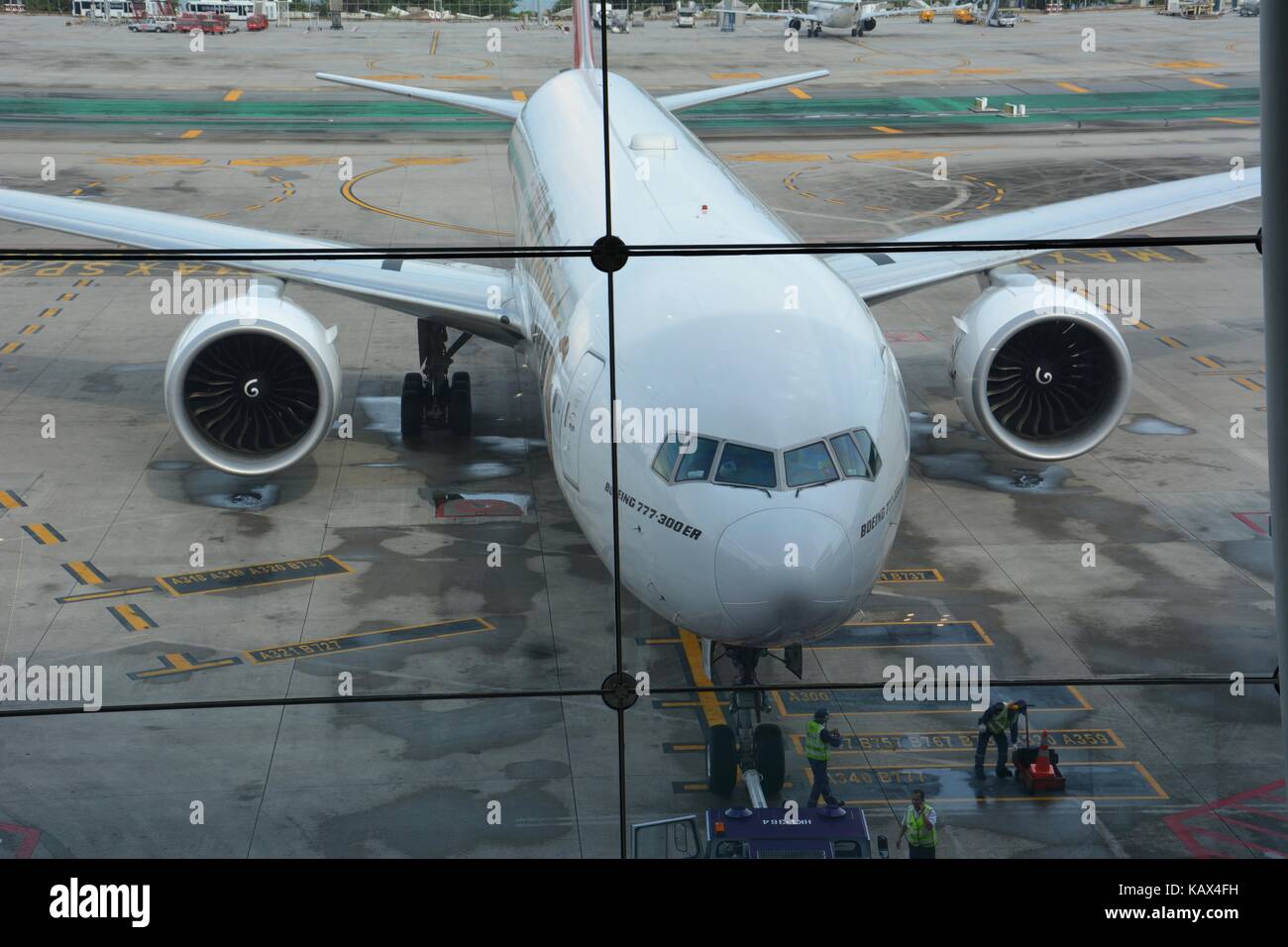 Boeing B777-300ER of Emirates at Gate at Phuket airport HKT Stock Photo