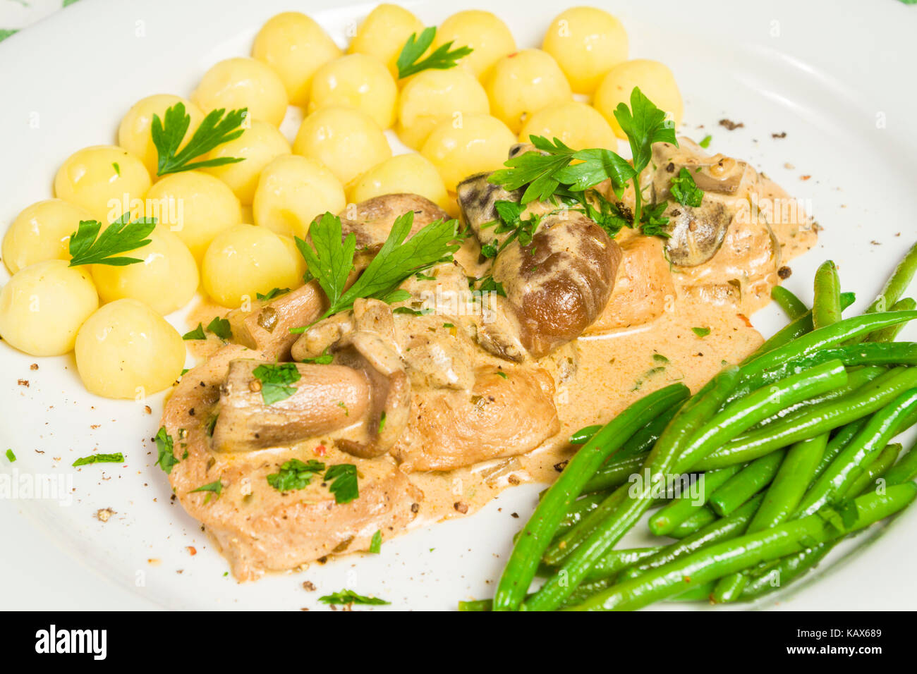 Pork tenderloin with potatoes and wild mushroom sauce and green beans