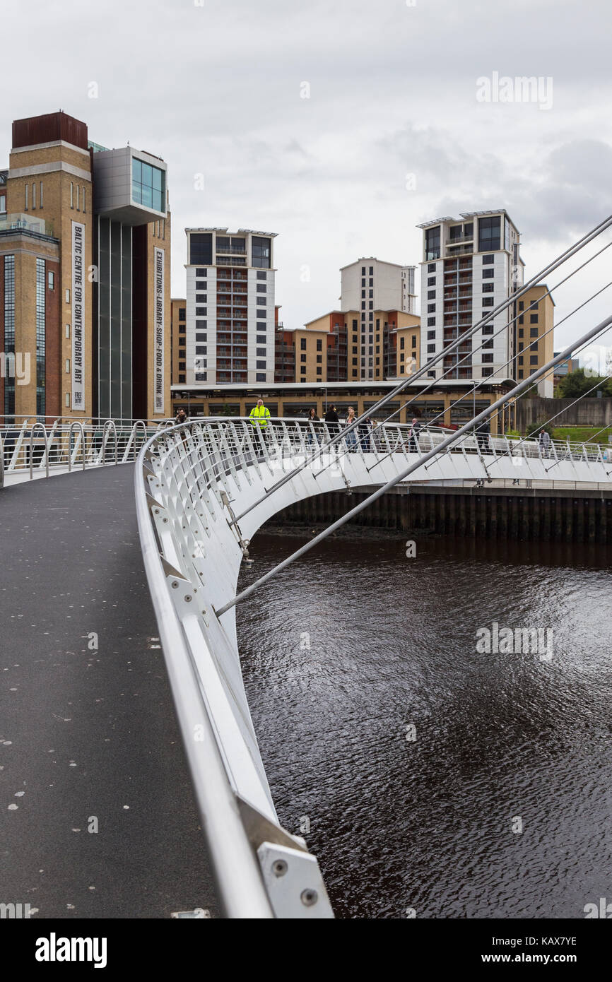 People Crossing Millennium Bridge between Gateshead and Newcastleupon