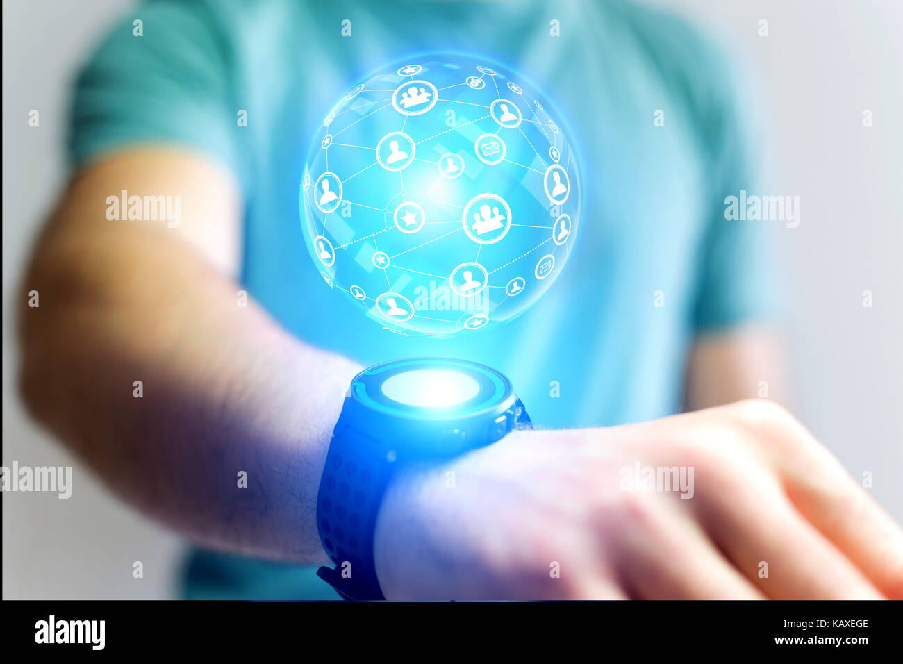 View of a Businessman holding smartwatch with network globe sphere hologram  going out - Technology concept Stock Photo - Alamy