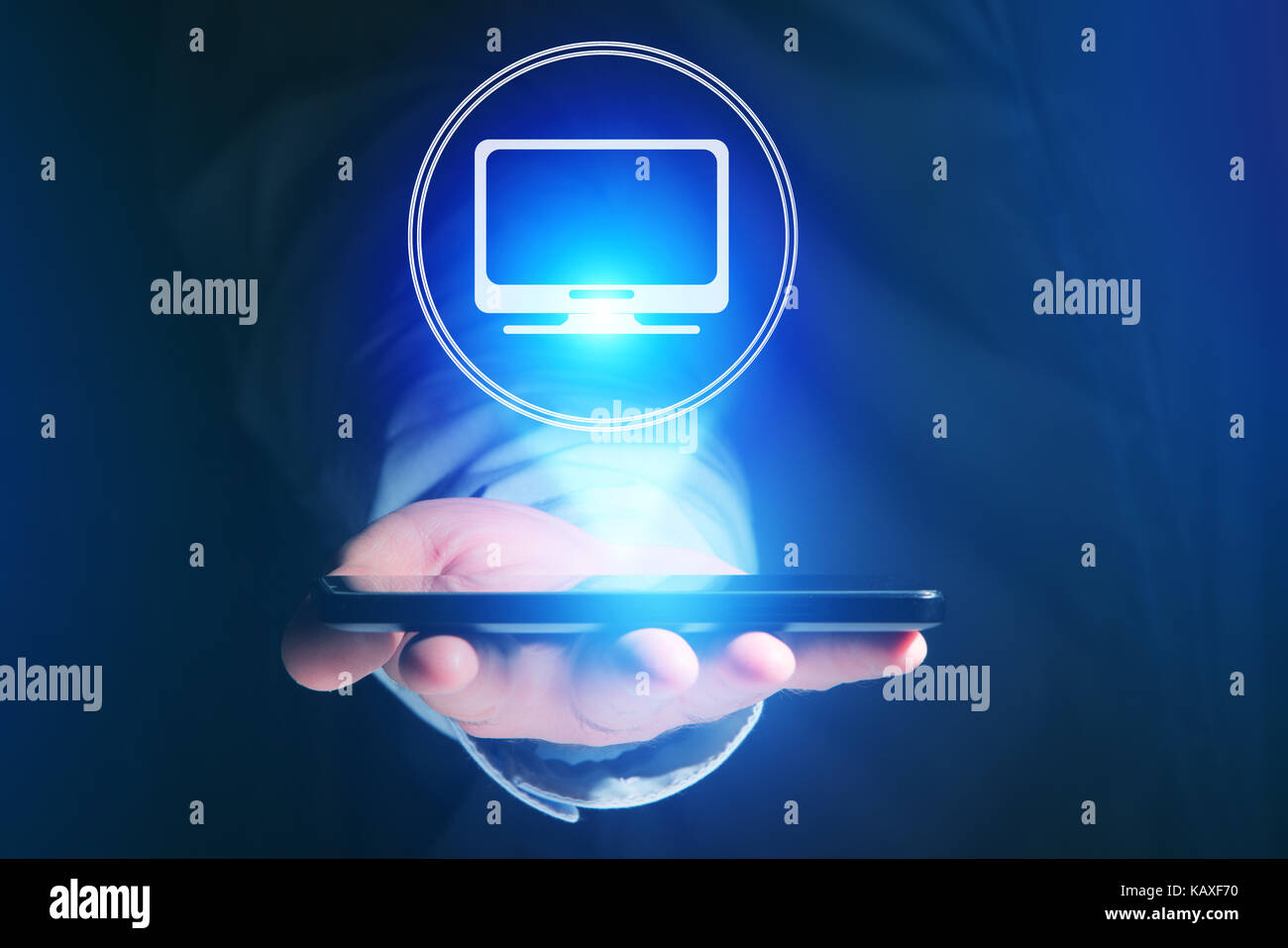 View of a Businessman hand holding mobile phone with computer icon ...