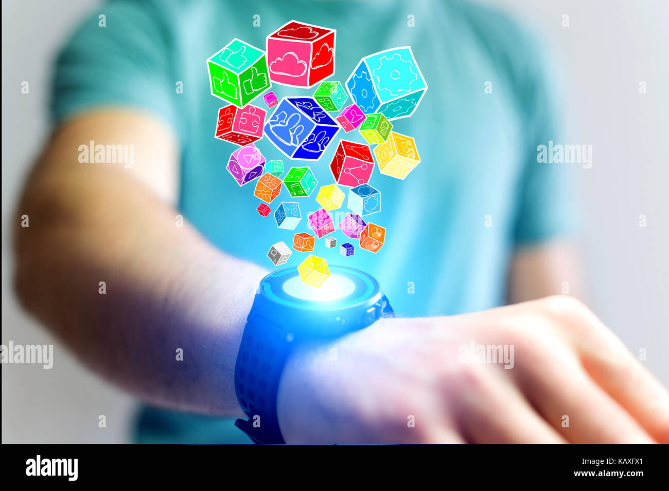 View of Colorfull application cube going out a smartwatch - Technology concept Stock Photo