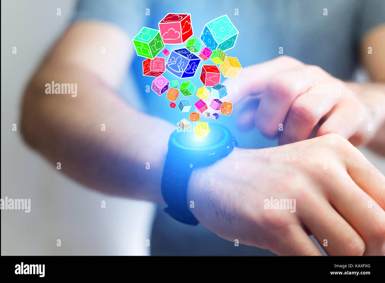 View of Colorfull application cube going out a smartwatch - Technology concept Stock Photo