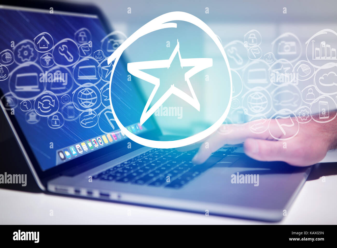 View of a Star icon going out a laptop interface - technology concept Stock Photo