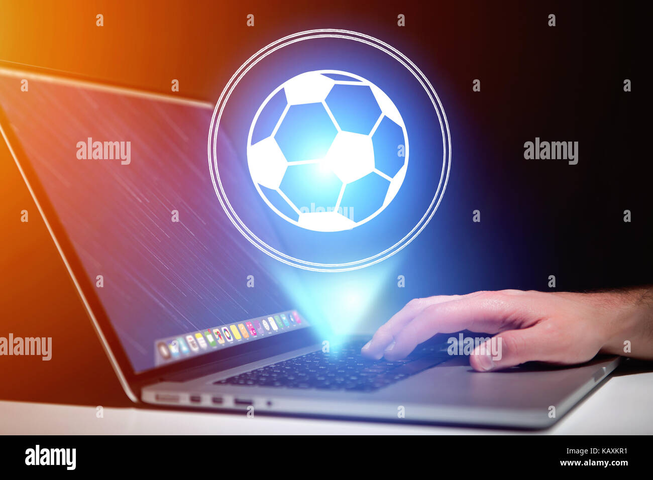 View of a Soccer ball icon over device - Sport and technology concept Stock Photo