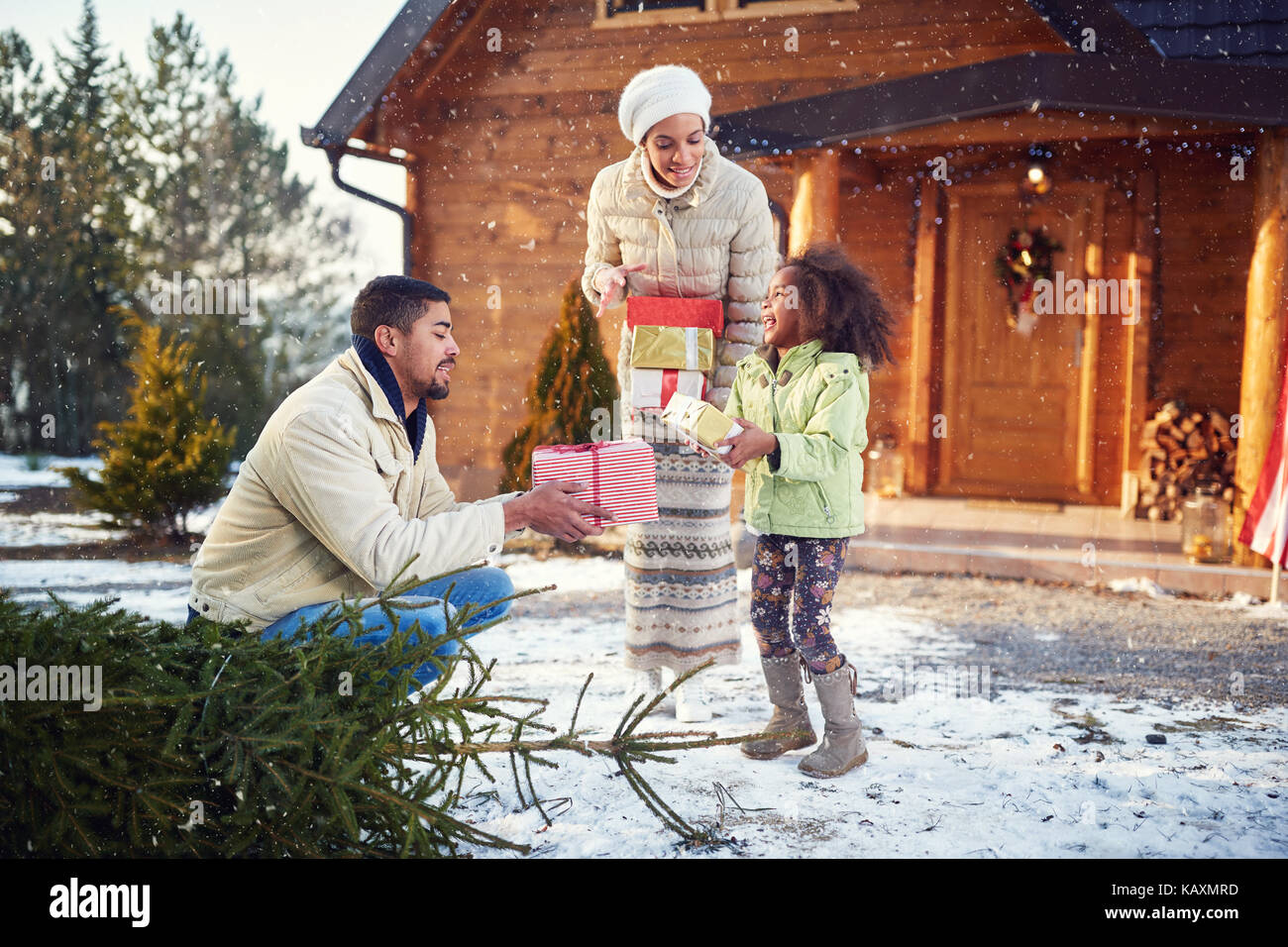 happy little afro American child parents give Christmas presents Stock Photo