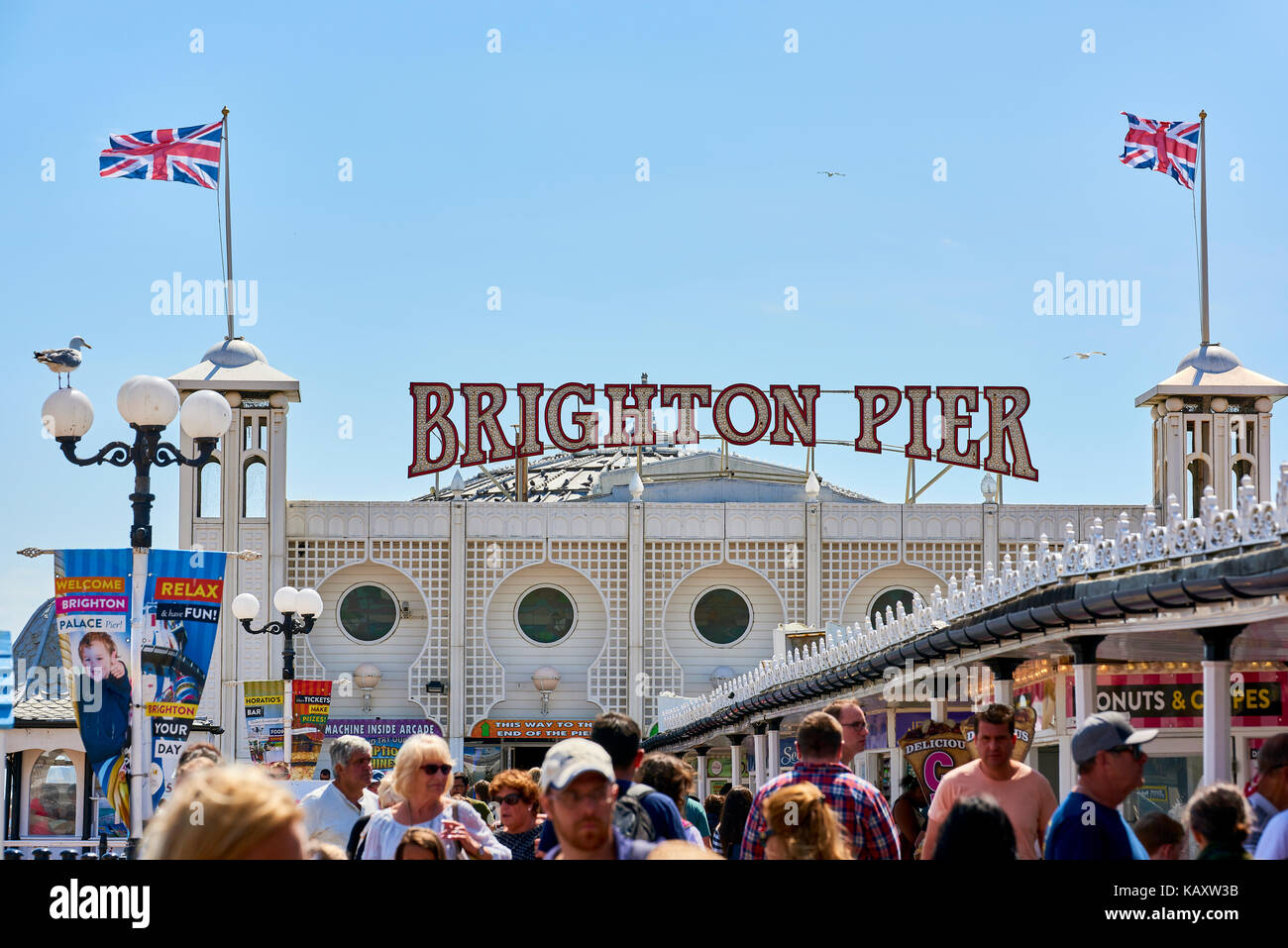 Detail of Brighton Pier entrance, with Union Jacks flying Stock Photo