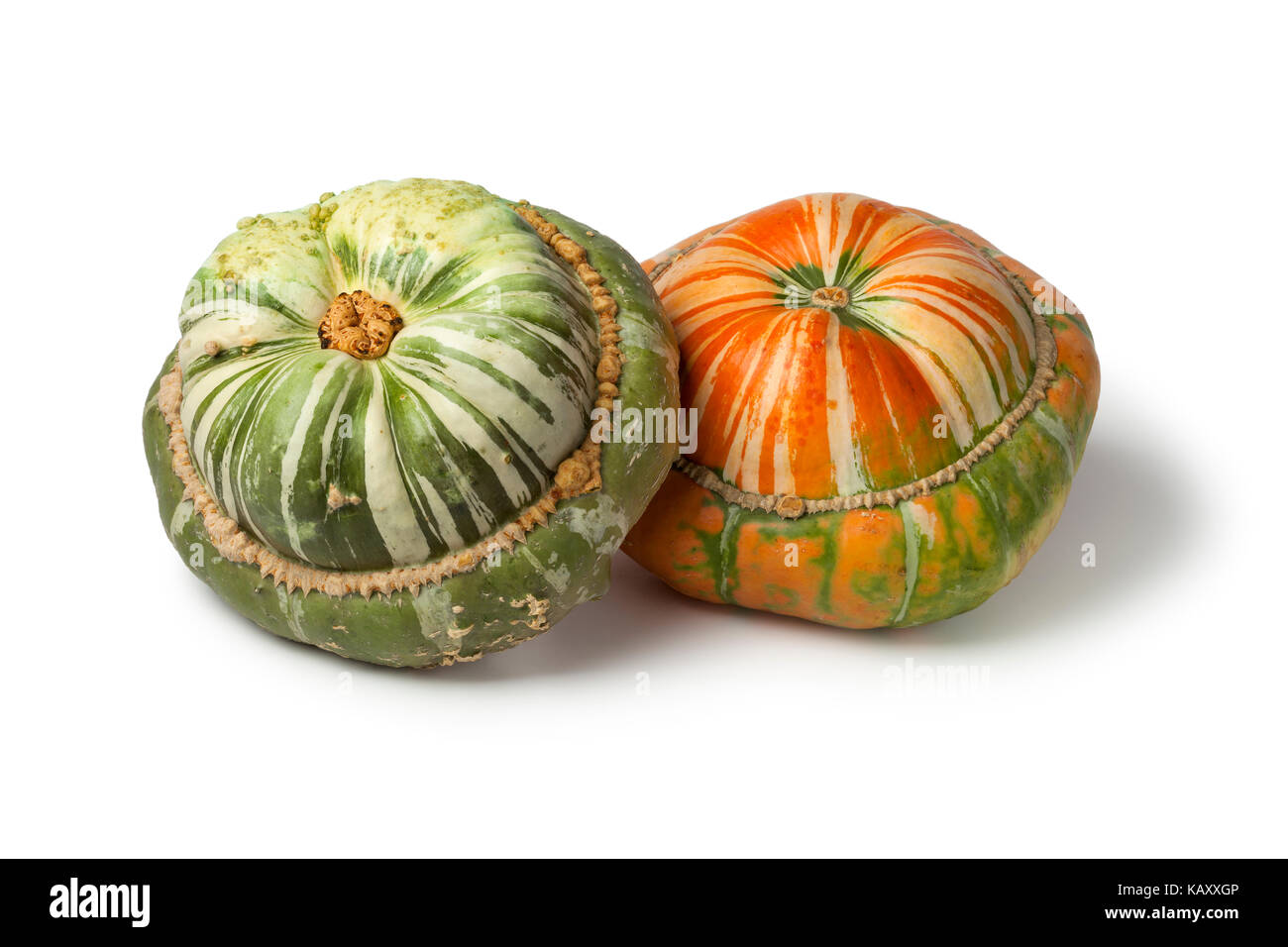 Fresh heirloom orange and green Turban squashes on white background Stock Photo