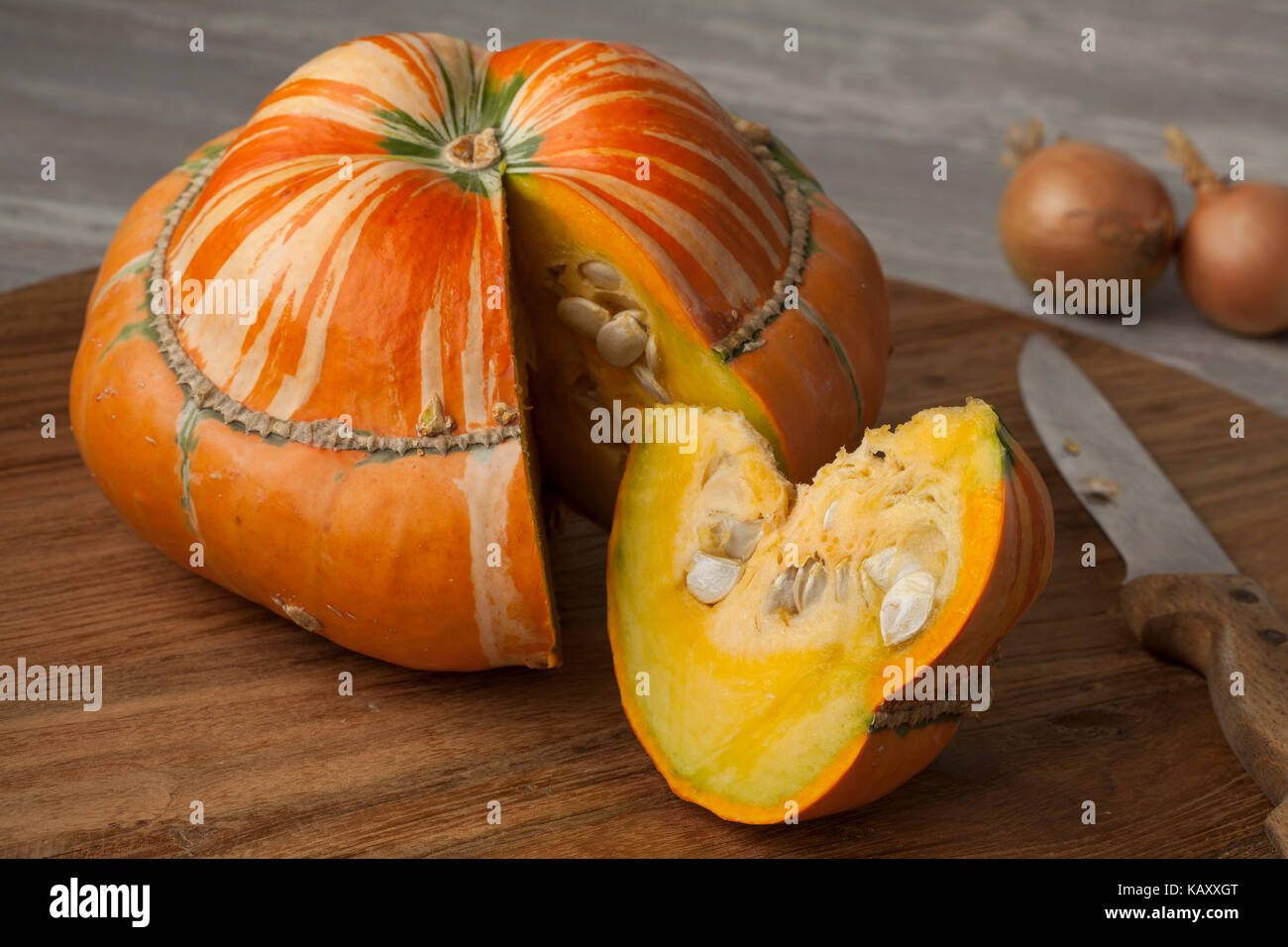 Fresh heirloom orange Turban squash and slice Stock Photo