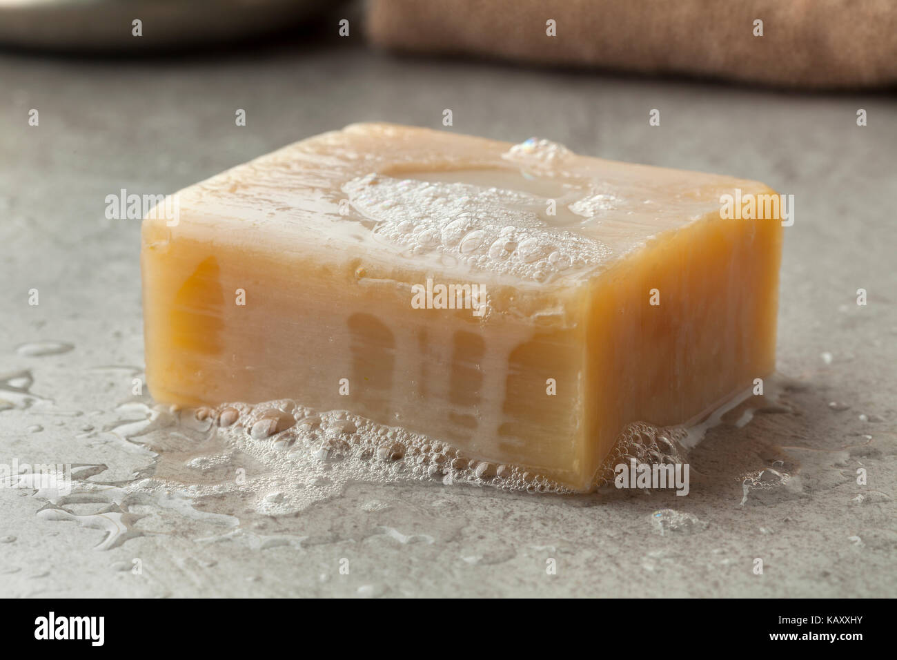 Wet piece of traditional Moroccan soap with foam for hamam Stock Photo