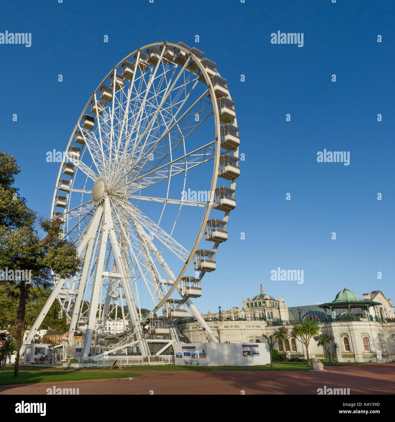 The Riviera Wheel in Princess Gardens Torquay, Devon, UK with the Victorian Pavilion in the background on a sunny summer's day with clear blue skies Stock Photo