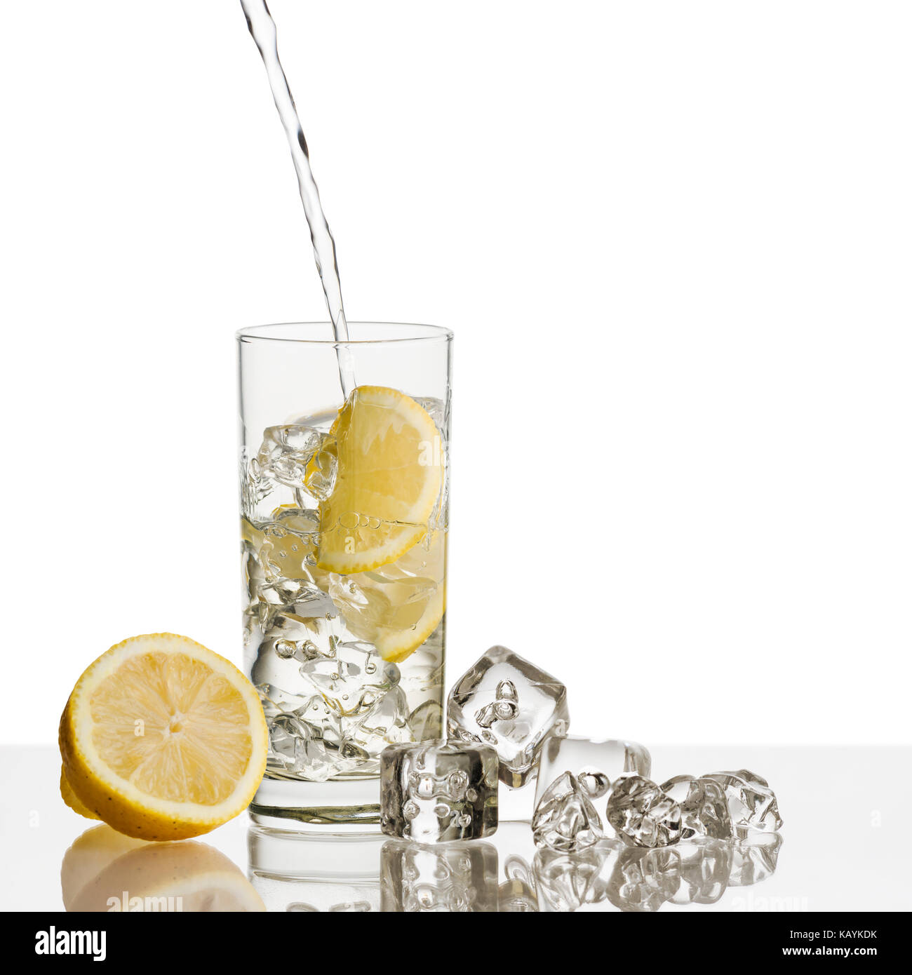 glass full of fresh water with lemon and ice cubes on background Stock ...