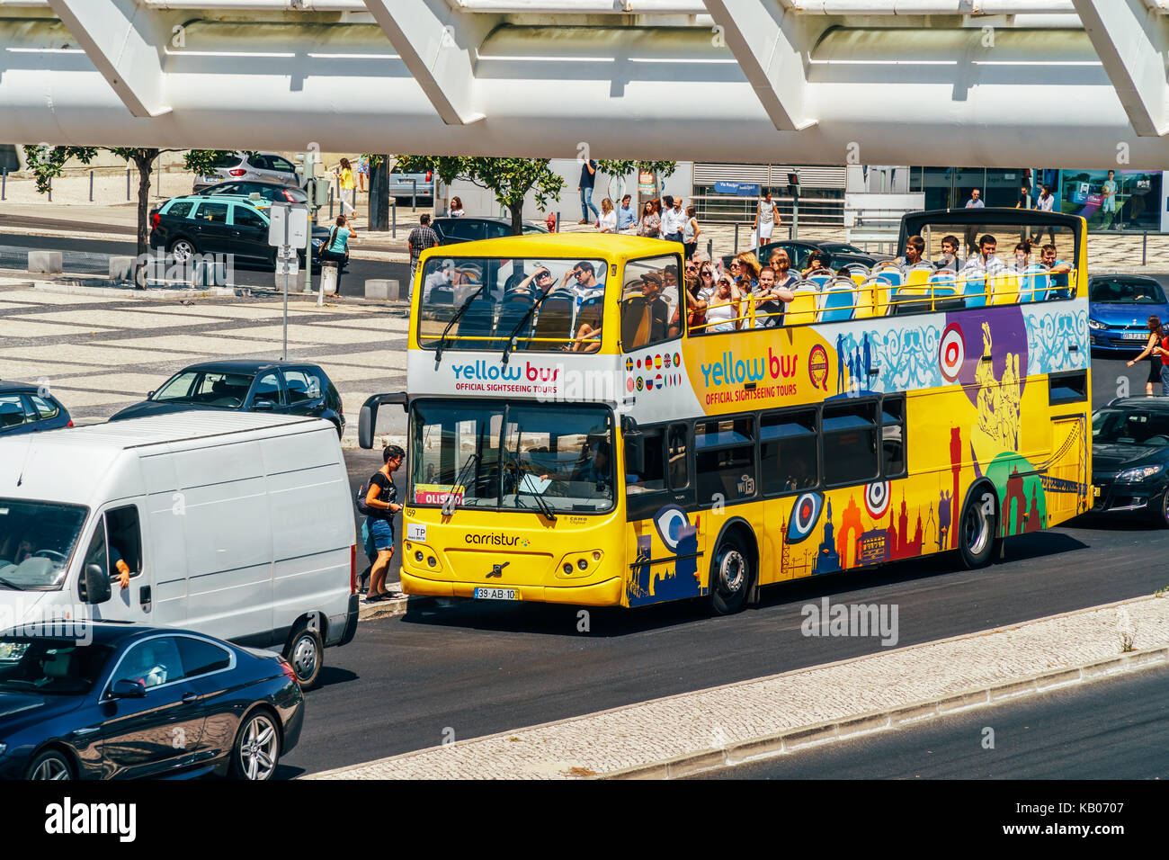 LISBON, PORTUGAL - AUGUST 10, 2017: Lisbon Hop On Hop Off City Tour Yellow Bus offers tourists visiting Lisbon a complete tour of the most important l Stock Photo