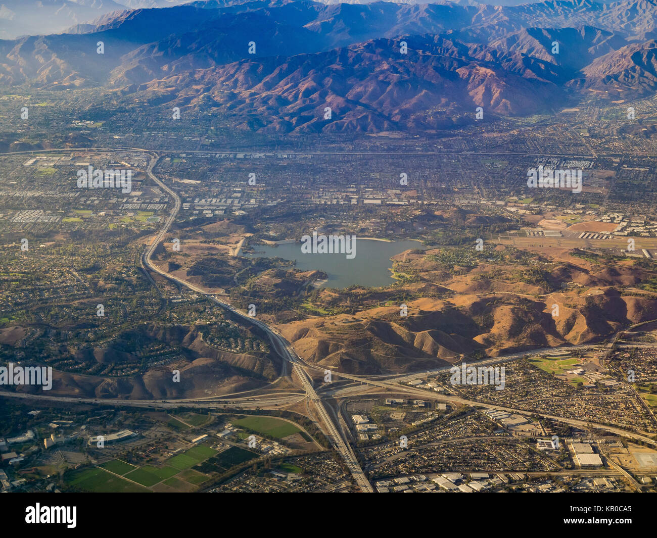 Aerial view of San Dimas and Puddingstone Reservoir, view from window seat in an airplane