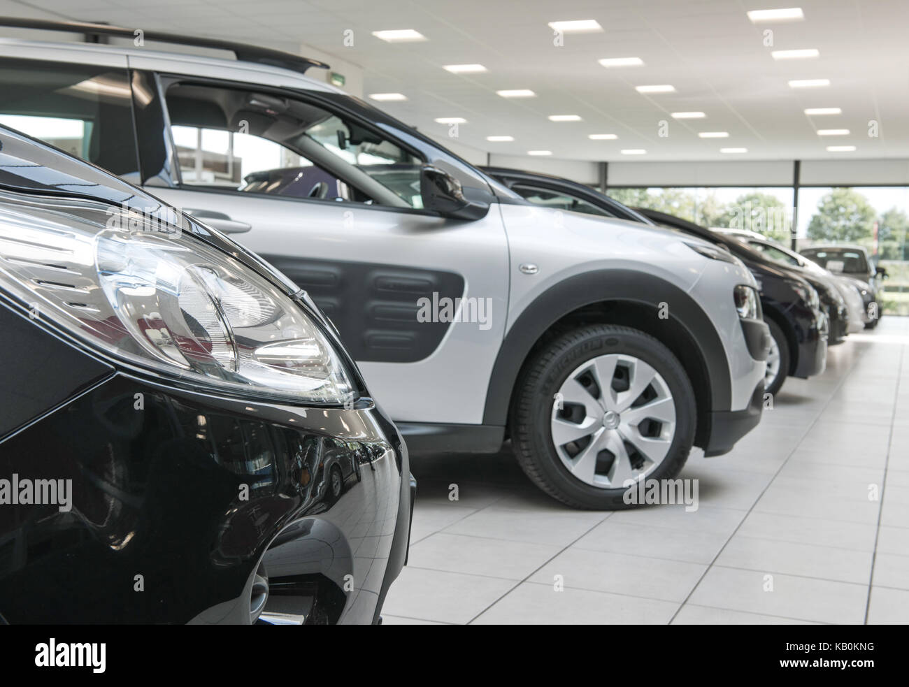 cars for sale in a showroom Stock Photo