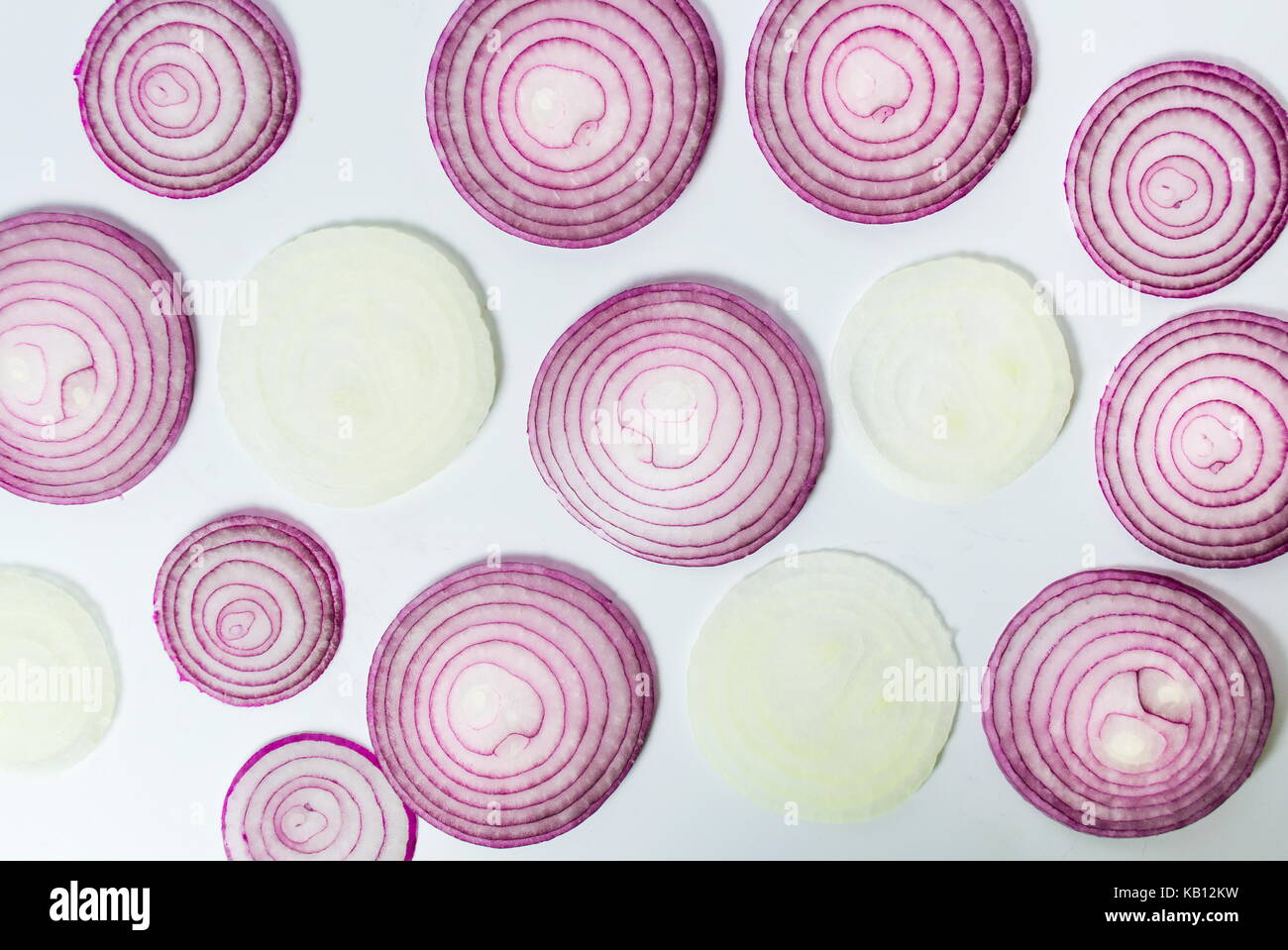 Purple onion raw slices on white background Stock Photo - Alamy