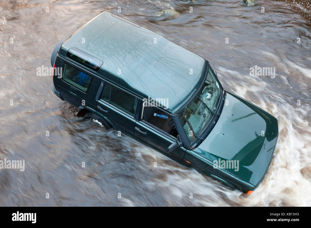 A 4x4 Vehicle Swept Away by Floodwater While Trying to Cross a Ford on the River Wear in Westgate, Weardale, County Durham UK. The Driver Was Rescued  Stock Photo