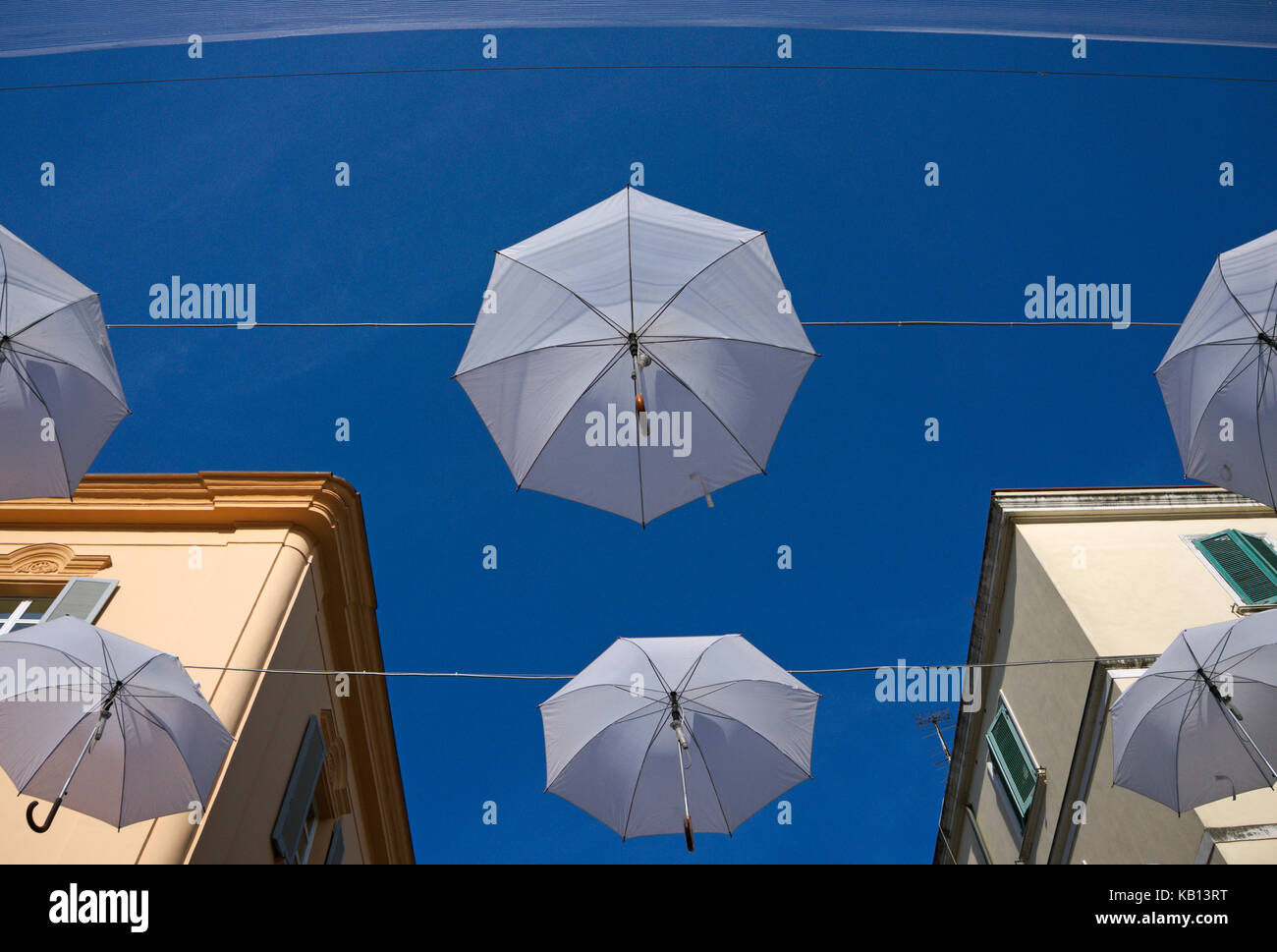 Hanging umbrellas in a street Stock Photo