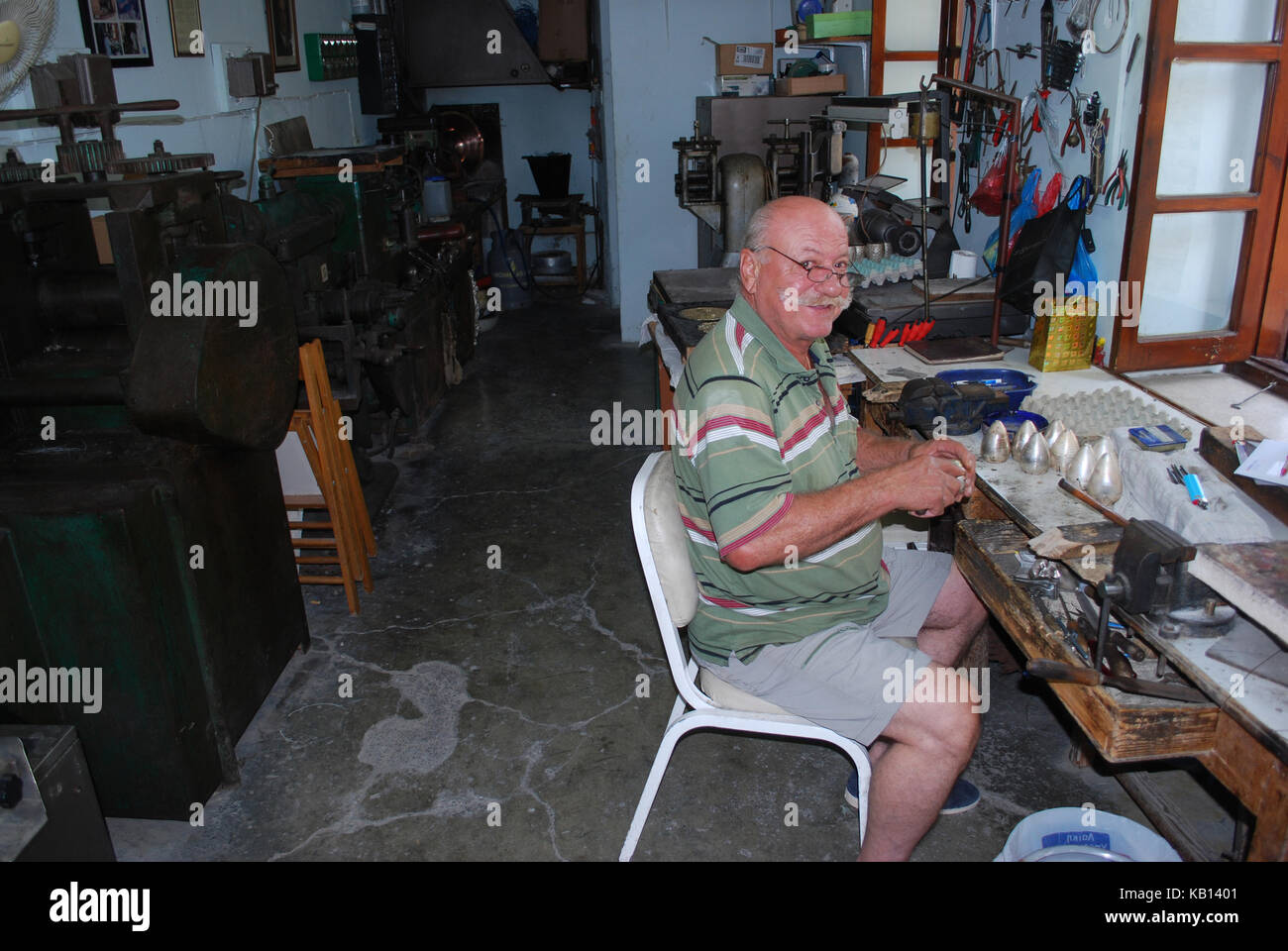 A Cypriot Lefkara born craftsman working in a silver shop in the small Cypriot village Lefkara in Cyprus Stock Photo