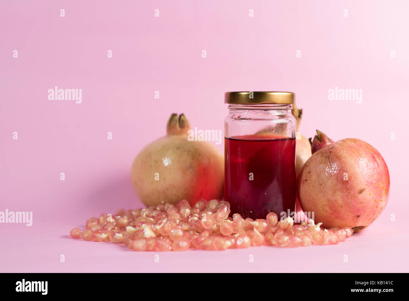 Can opener and pomegranate - open pomegranate for juice Stock Photo - Alamy