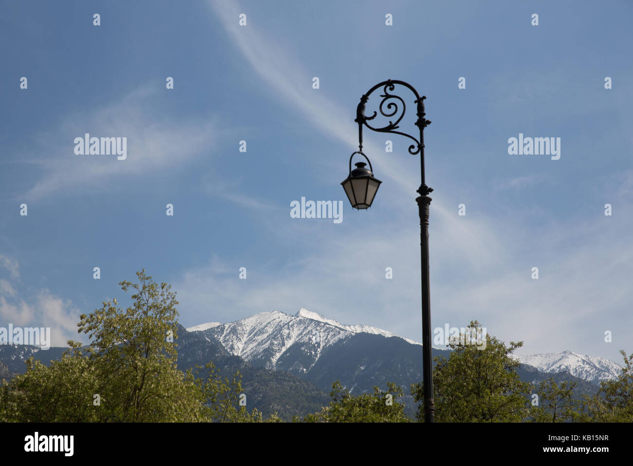 Mount Canigou and lamp-post in car park of St.Michel de Cuxa, Pyrénées-Orientales Stock Photo